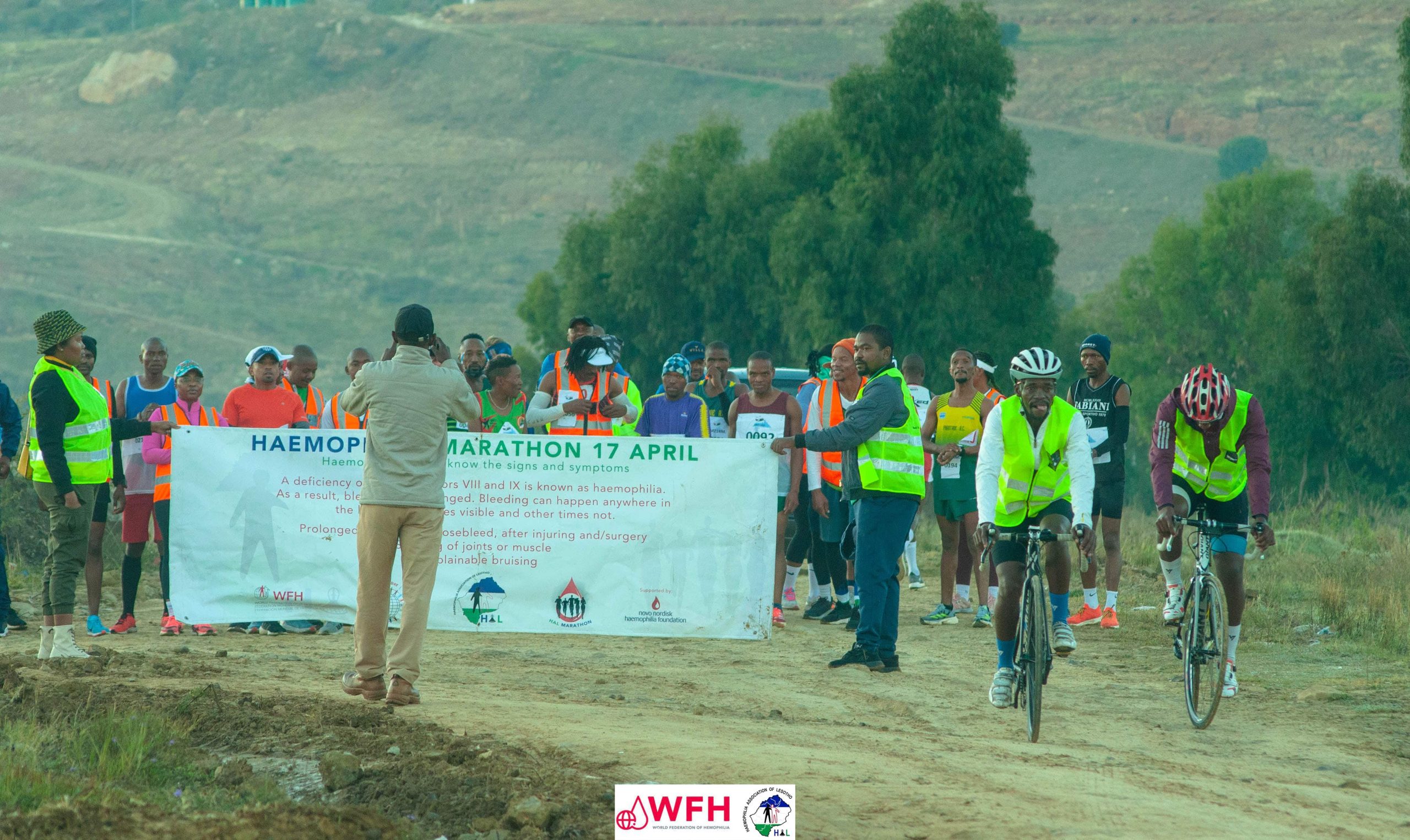 HAL awareness marathon participants with banners